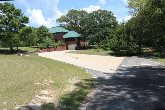 Red barn and outbuildings on the estate grounds